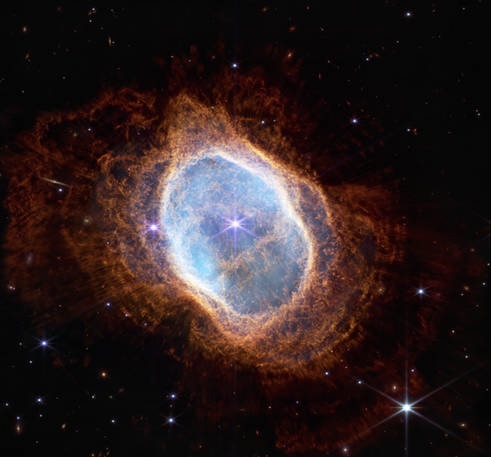 This image shows a dying star that has been sending out rings of gas and dust for thousands of years in all directions.