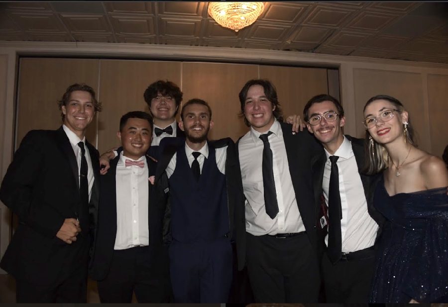 Senior friends pose for a picture during a dance break.