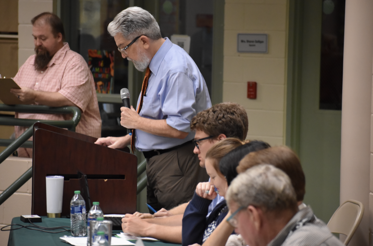 Faculty listens closely to Mr. Huffs questions. 