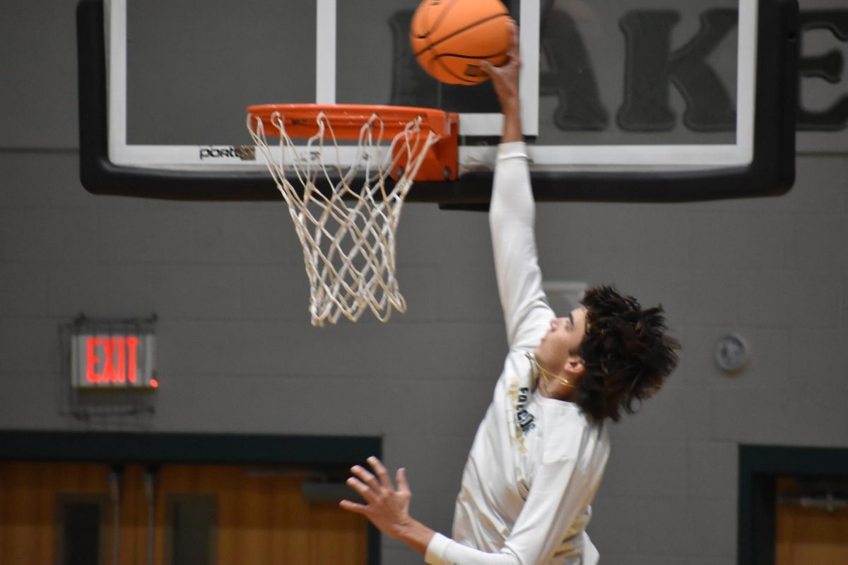 Senior Nick Yatros goes in for a layup