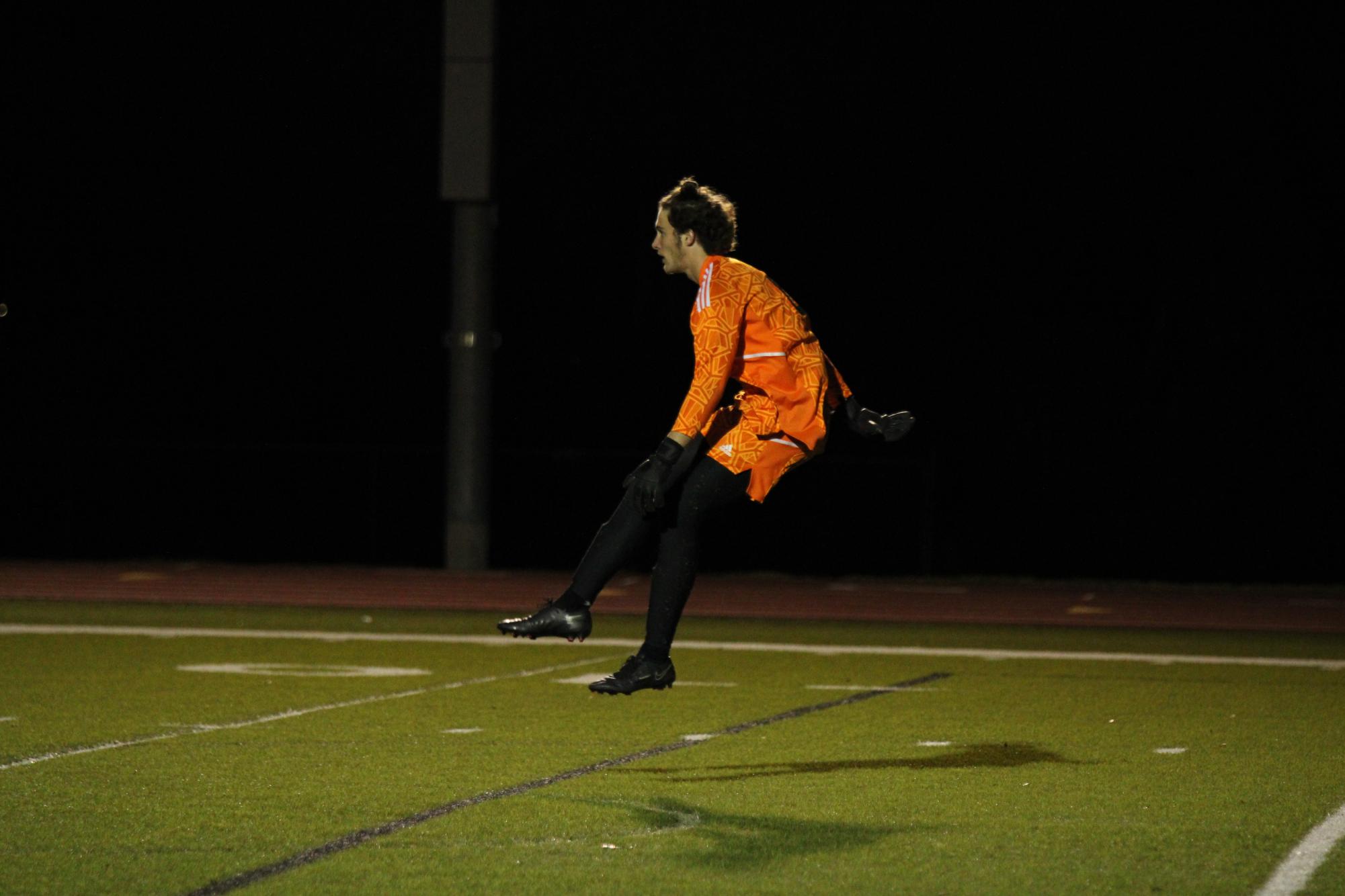 Goalkeeper Austin Varga lsends off a punt