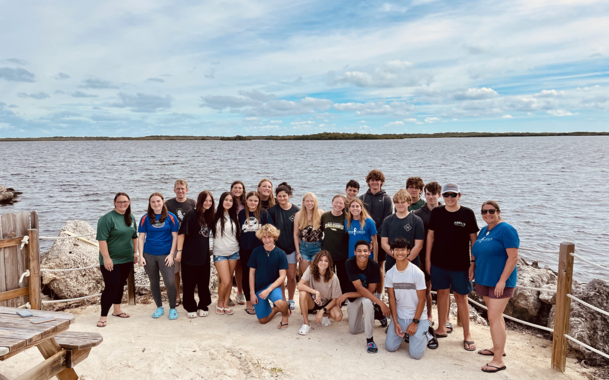 Marine science students smiling after their jam-packed week of marine excursions. 