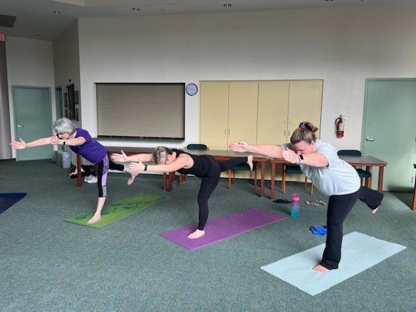 History teacher Dr. Yuengling and science teacher Mrs. Boothby participate in after-school yoga, as part of the Wellness Initiative