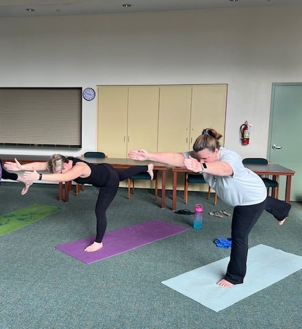 History teacher Dr. Yuengling and science teacher Mrs. Boothby participate in after-school yoga, as part of the Wellness Initiative