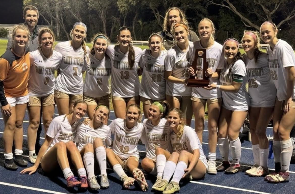 The+girls+soccer+team+celebrates+after+their+big+win+at+districts.+