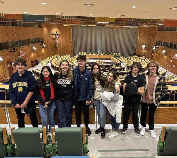 Pictured is last years delegation to the Model UN.  In the background is the United Nations actual meeting room in New York City. 