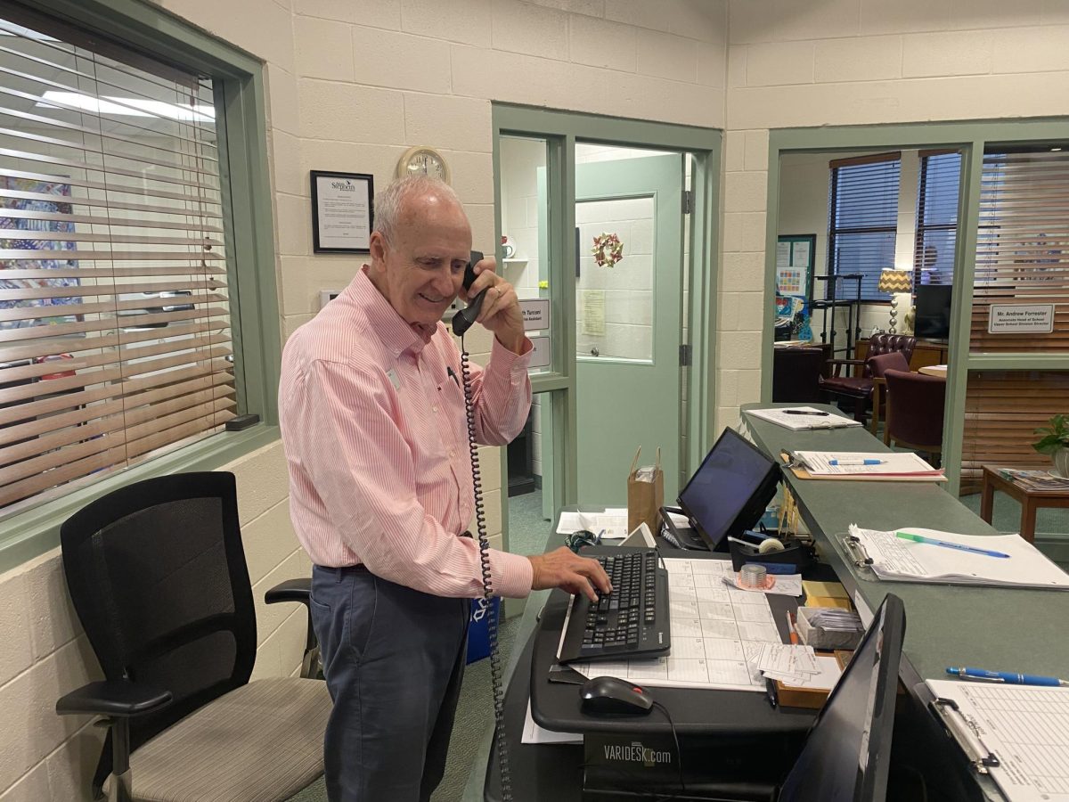 Mr. Holt in his element working the front desk. 