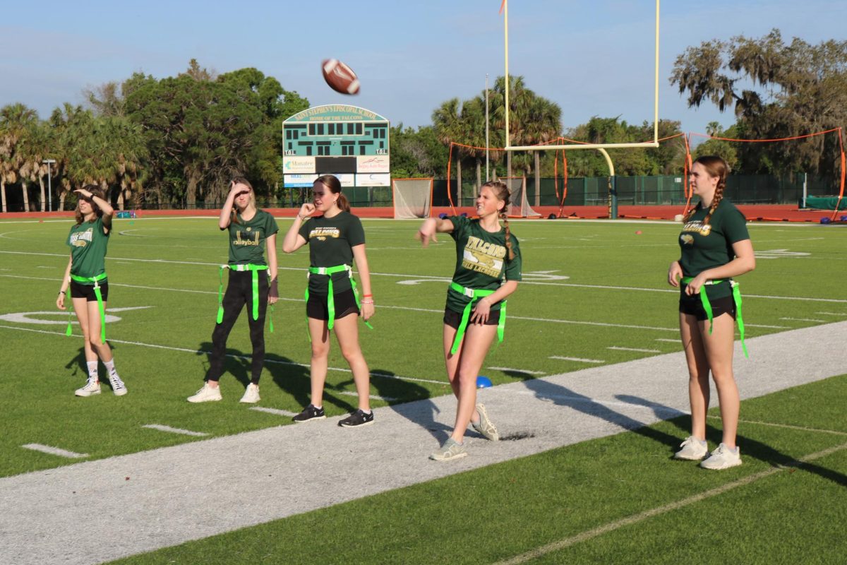 Sophomore Caroline Turner throws in the warmups. 