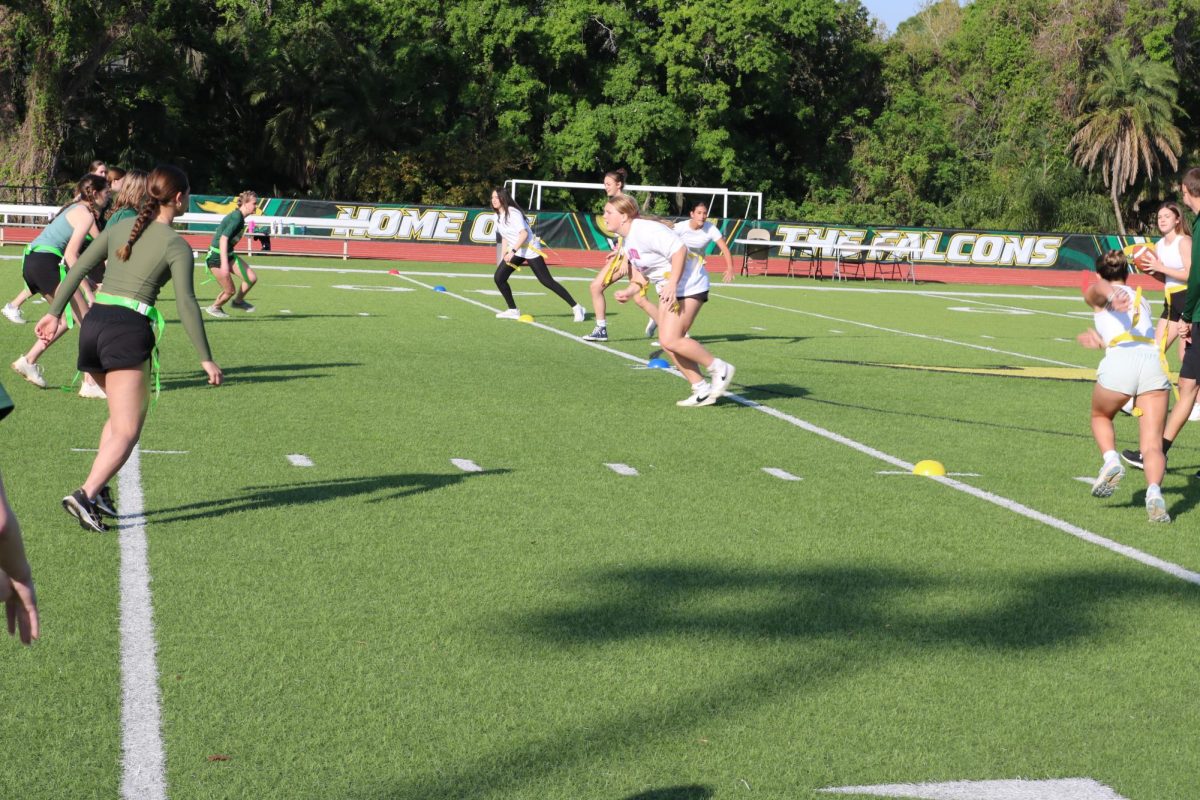 The sophomores and juniors jump of the line to start the game.