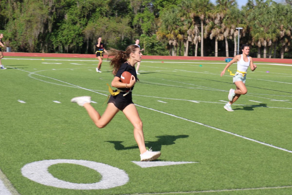 Senior Sienna Cassella burns the defenders on her way down the field. 