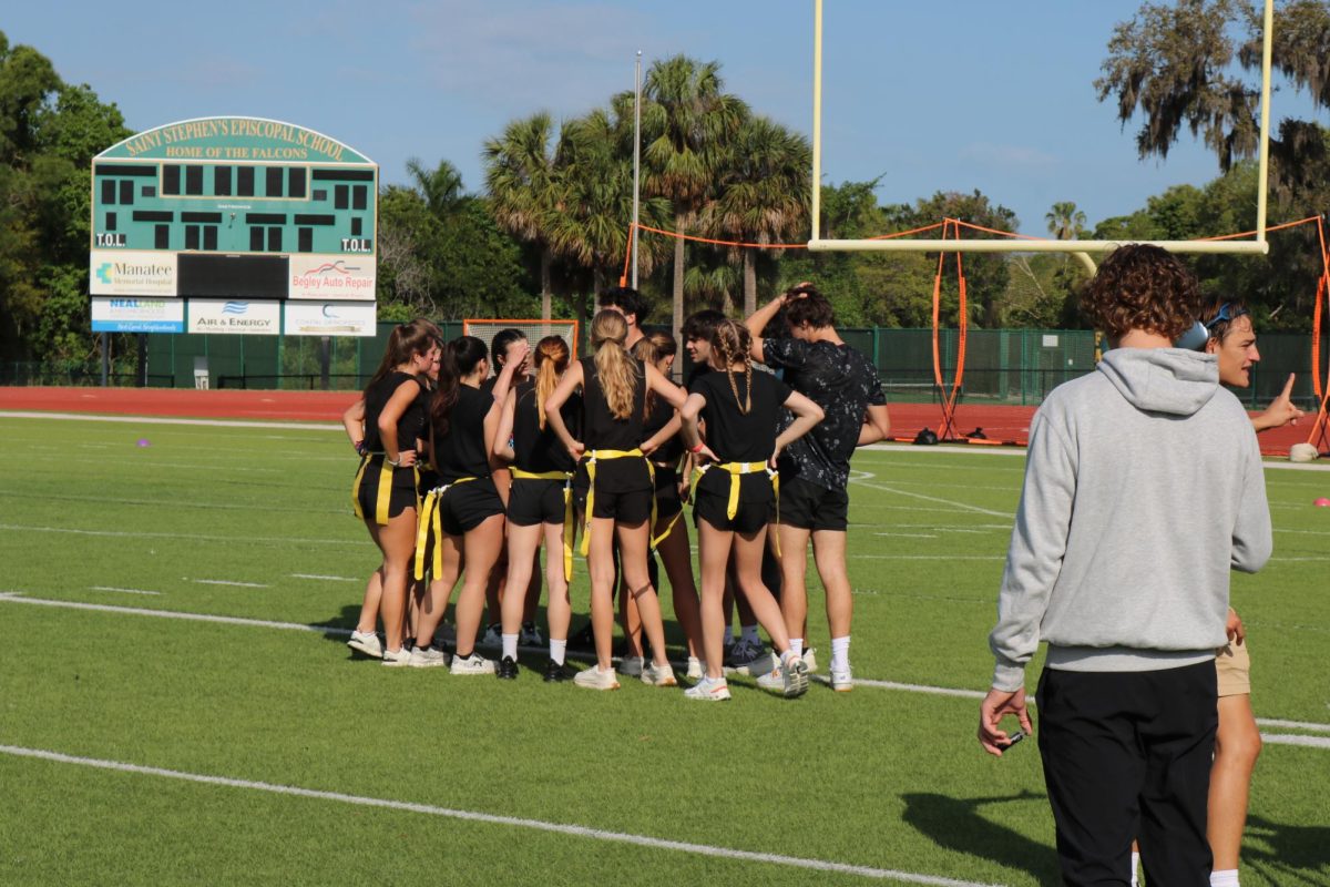 The seniors huddle up before the final game against the juniors.