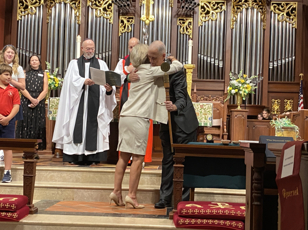 Mr. Kraft hugging Dr. Pullen during his investiture ceremony earlier this year, when Kraft was installed as the new Head of School for Saint Stephens. 