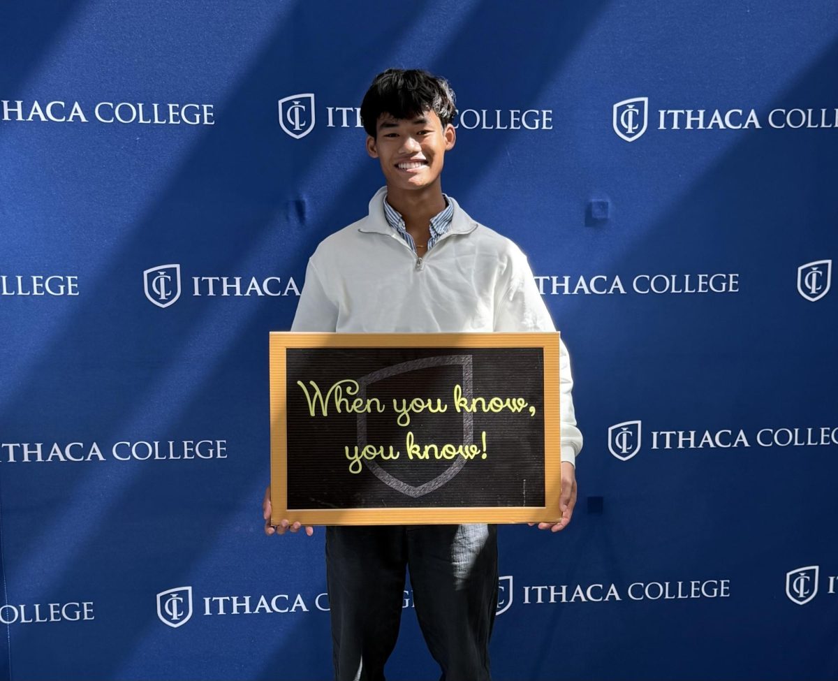 Kavi celebrating his official visit to Ithaca College.