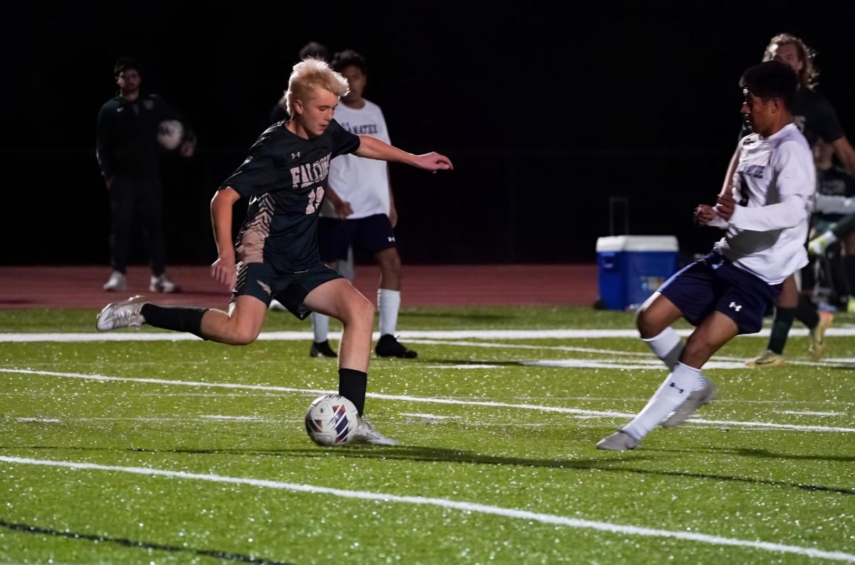 George Frano passes the ball up the field to his forwards 