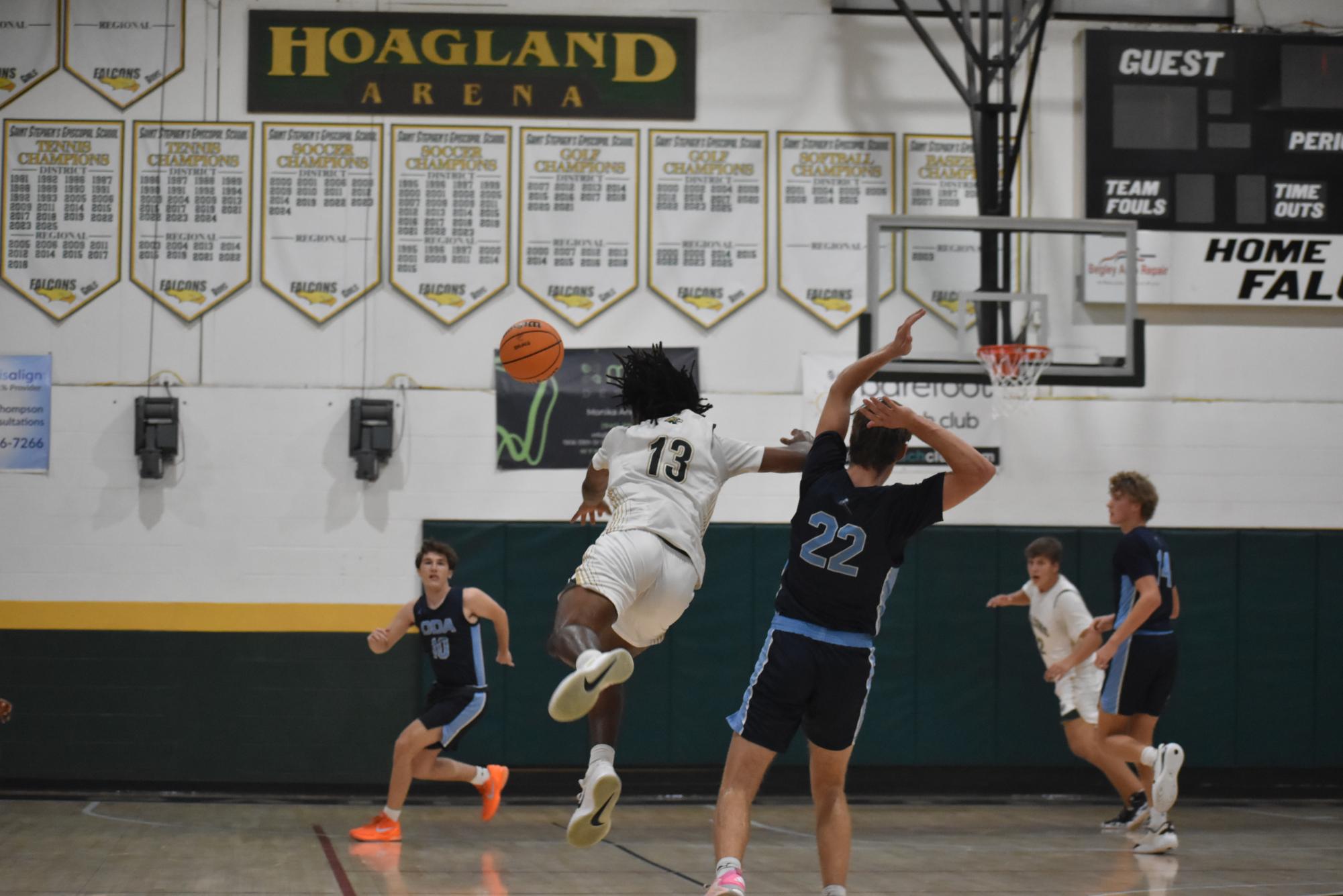 Junior Jerrod Long launches the ball across the court to his teammate.