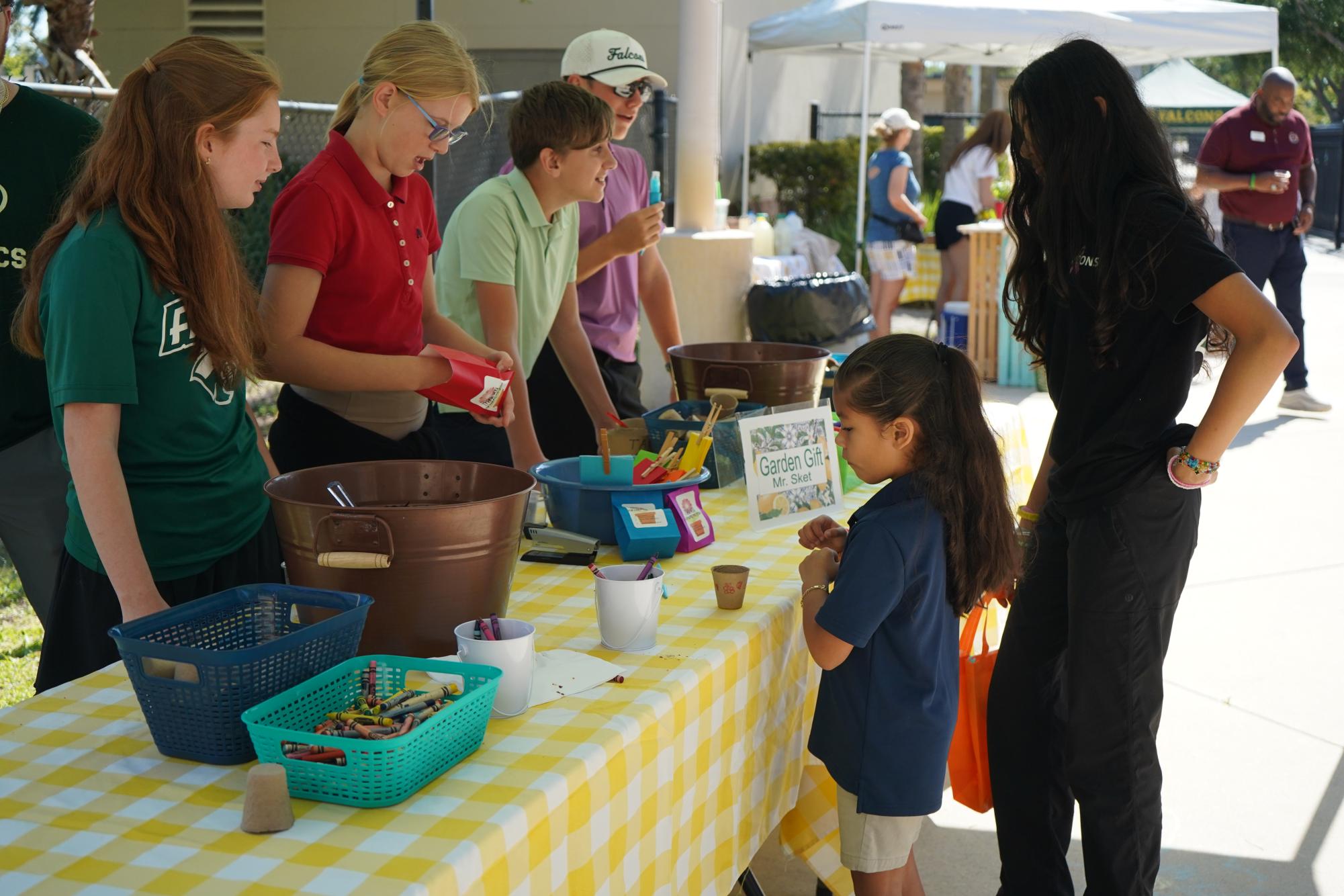 At the Garden Gift station, students plant a seed in a small cup filled with soil and take it home to grow their own flower. "It's a really fun and unique craft," 7th grade science teacher Mr. Alex Sket noted.