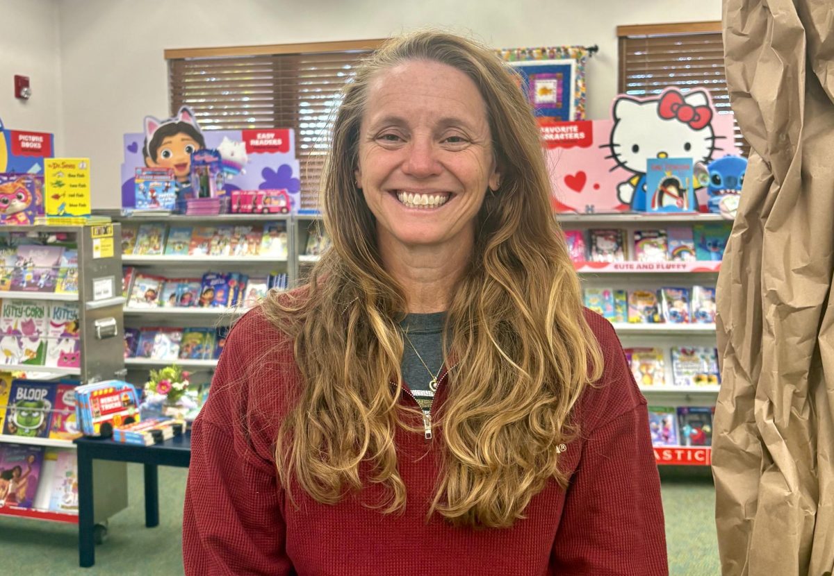 Lower and Intermediate School Librarian Mrs. Millican sets up for the annual lower school book fair.